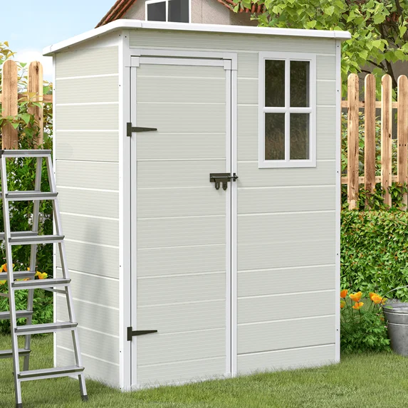Resin pent roof shed in a garden